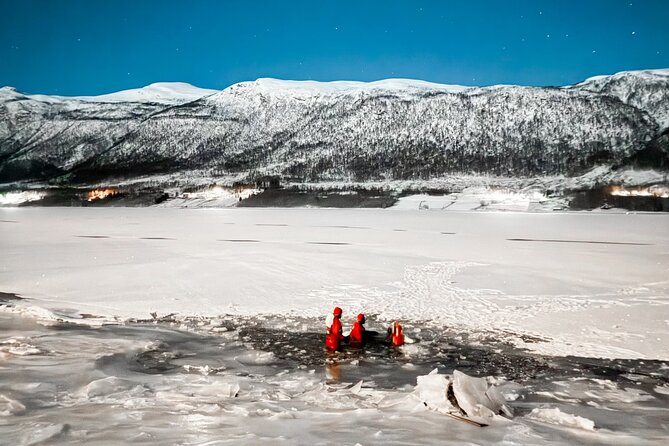 Arctic Ocean Night Floating in Ramfjord - Floating beneath stars, snowfall, and the Aurora