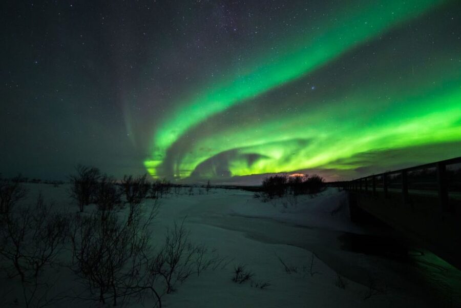 From Alta: Nighttime Northern Lights Spotting Tour - Riding by minibus to places with a clear sky