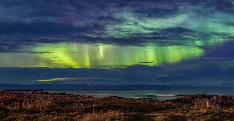 From Svolvær: Guided Northern Lights Tour by Van - Riding through Vågan in search of open sky