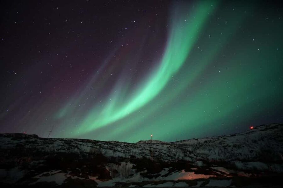 From Tromsø: Aurora Bus Tour with Snacks, Photos, and Drinks - Meeting the guide in central Tromsø