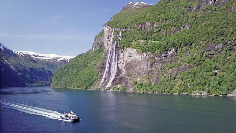 Geiranger: Fjord and Waterfalls Sightseeing Boat Trip - Cliffs, reflections, and the changing view