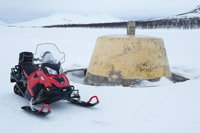 Snowmobile Adventure to 3-Country Border - Getting dressed at the Kilpisjärvi base