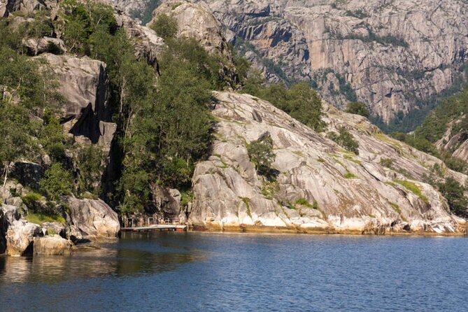 Stavanger: Waterfalls, Caves and Rock Tour By Sea - Indoor comfort, outdoor views, and snacks on board