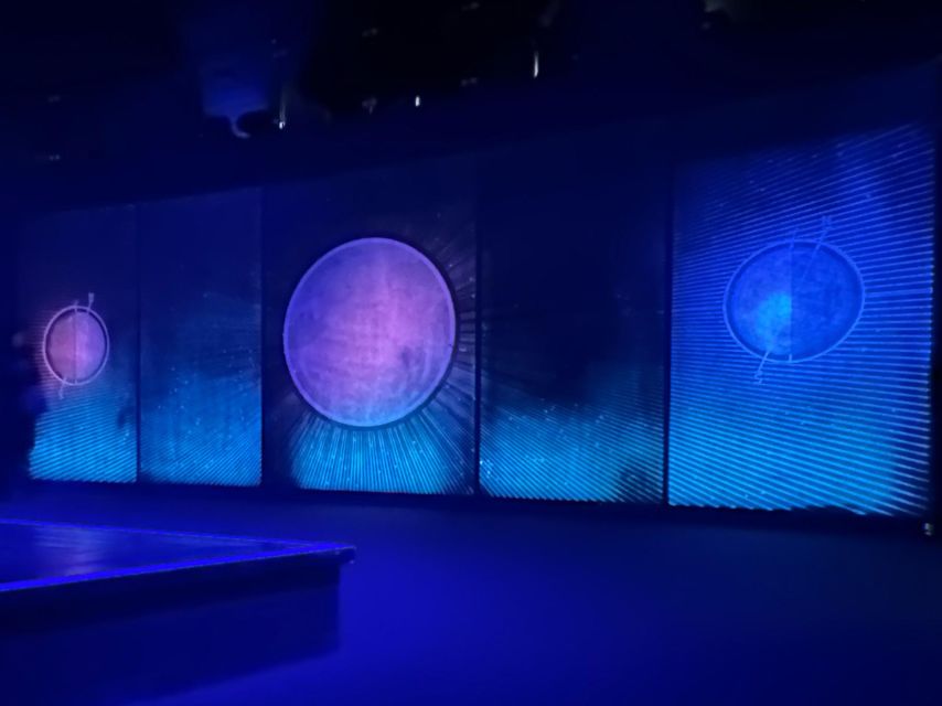 The North Cape Midnight Tour - The globe, cliff, and open ocean