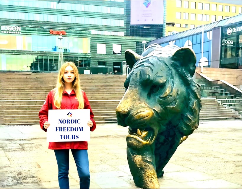 Tour a Pie en Oslo en Español - Starting with the Tiger at Jernbanetorget