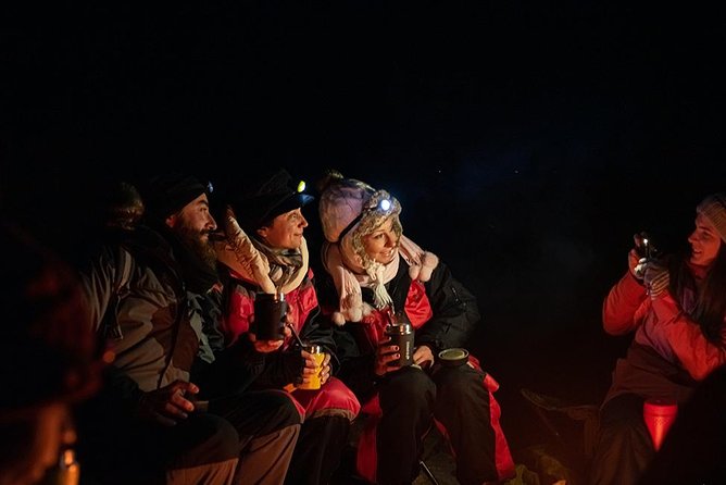 Tromso Aurora Hunt with Bonfire, Soup, Winter Gear & Transfers - Small group, minibus, and fixed drop-offs