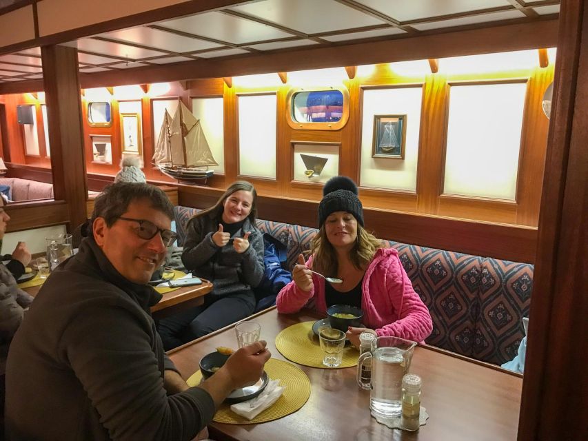Tromso: Luxury Northern Lights Cruise with Hot Tub & Dinner - Reindeer stew in the warm saloon