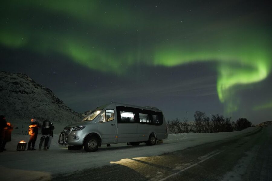 Tromsø: Northern Lights Tour with Free Professional Portrait - Waiting at the campsite with juice and lefse