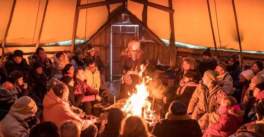 Tromsø: Reindeer Camp Dinner with Chance of Northern Lights - Warming up in the candle-lit lavvu