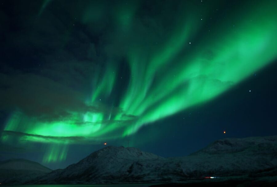Tromsø: Small-Group Adventurous Northern Lights Hunt - Walking through snow to a frozen lake